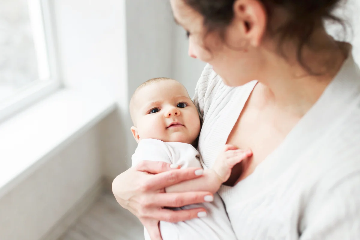 Woman with baby on white background